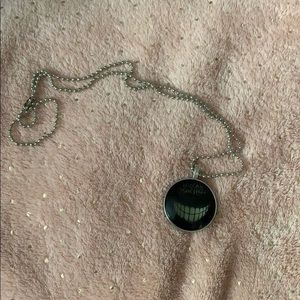 Glow in the dark Alice in wonderland necklace